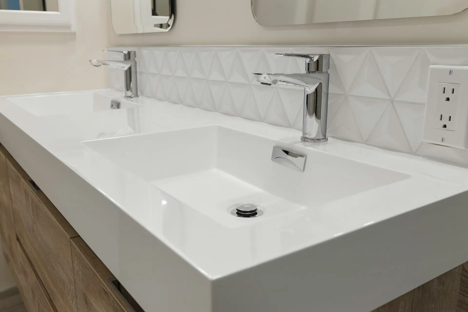 Modern bathroom vanity countertop with integrated white basin and chrome faucet