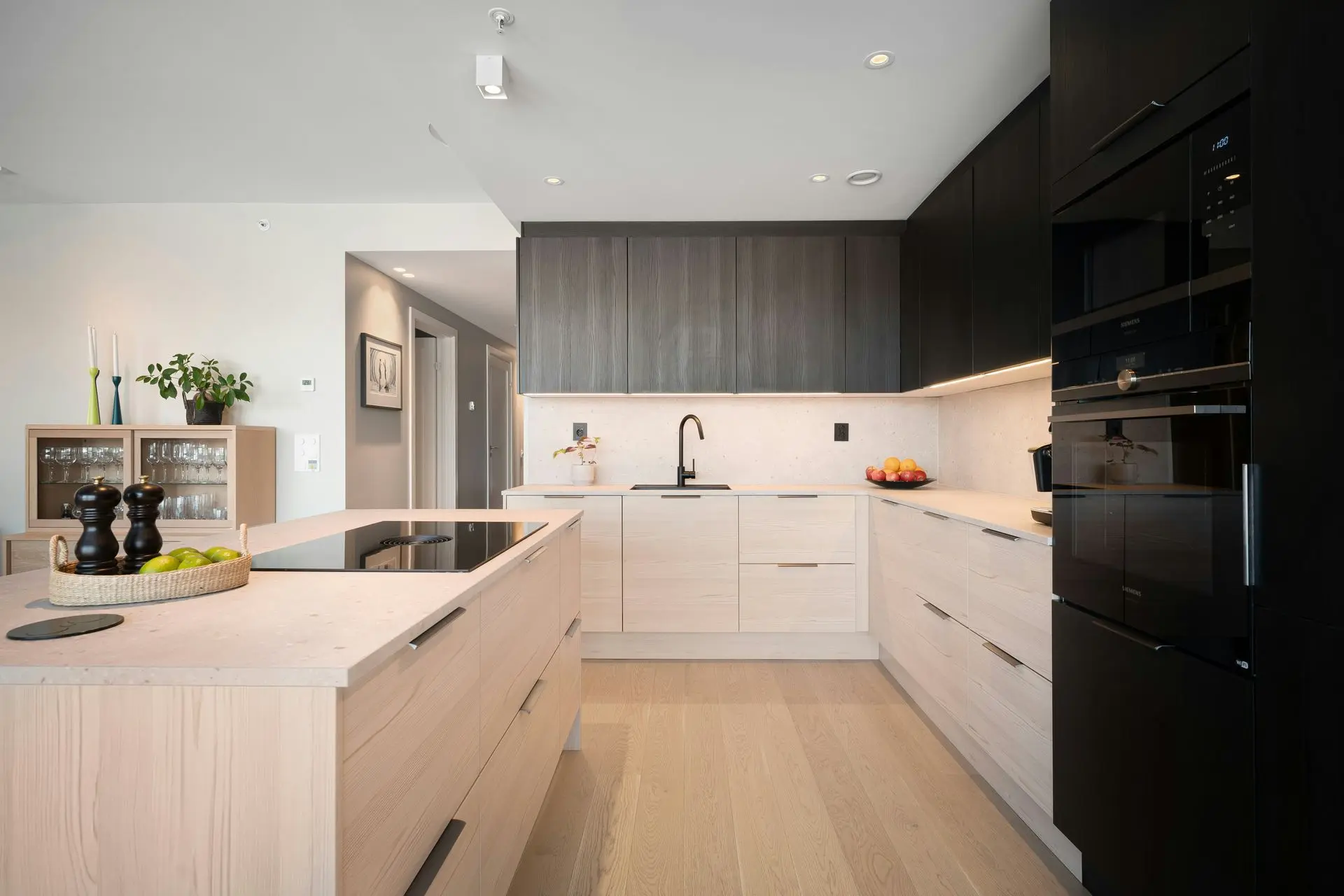 Modern residential kitchen with custom cabinetry and island layout