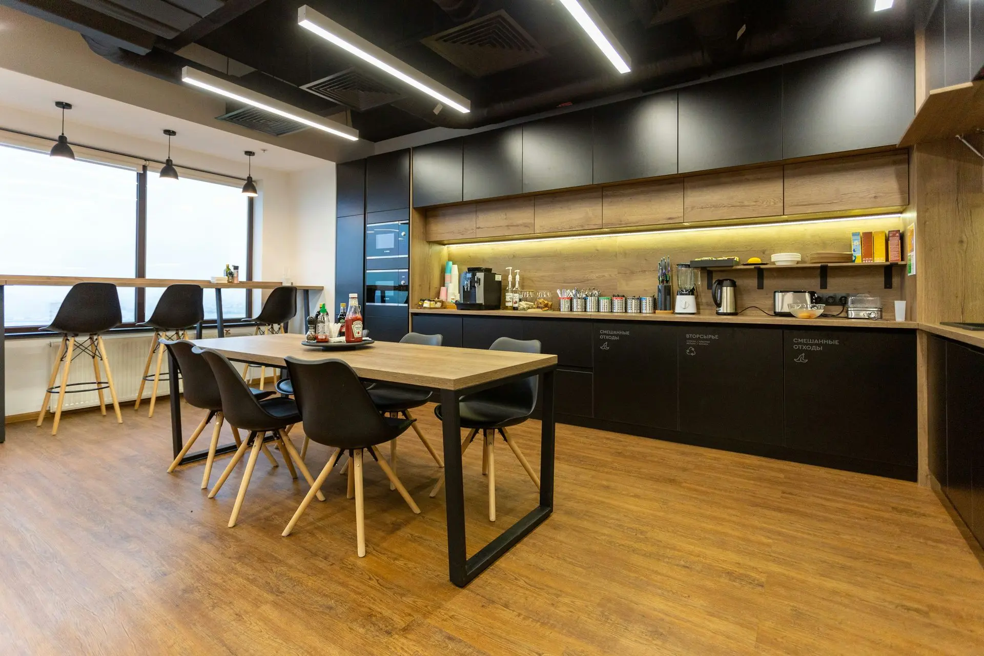 Commercial pantry kitchen with durable cabinetry and shared dining area