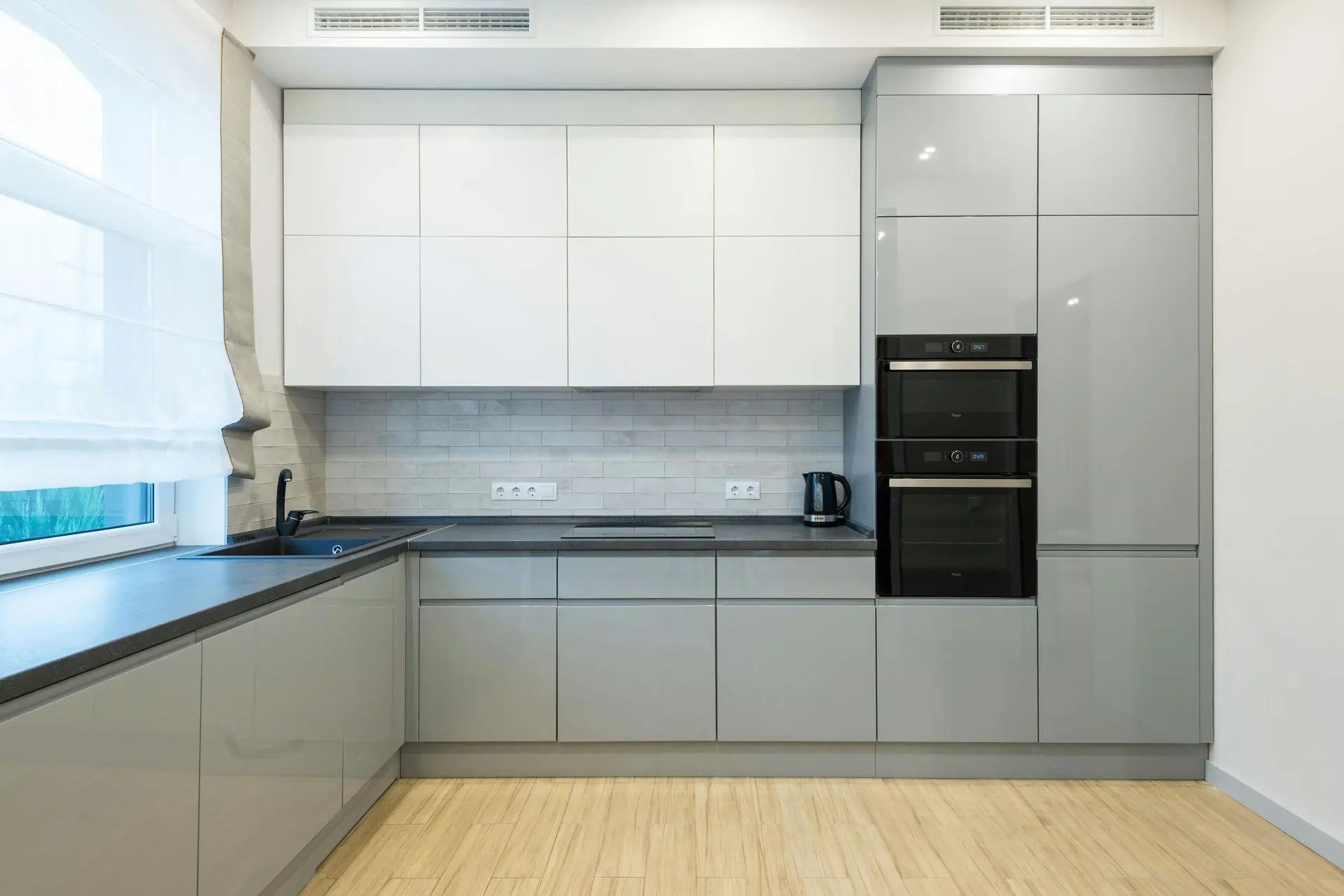 Hotel and serviced apartment kitchen with sleek built-in cabinetry