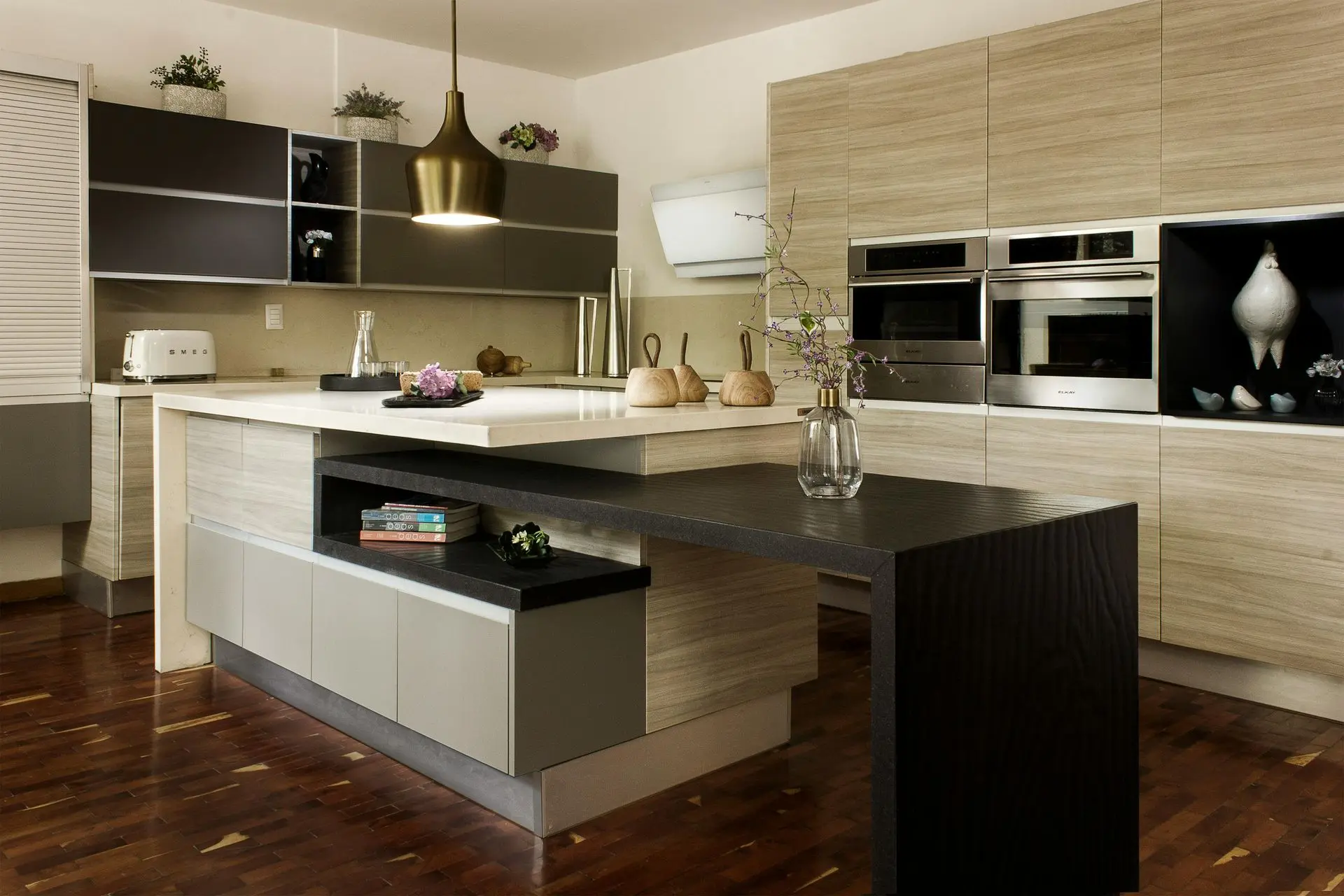 Engineered kitchen cabinetry with wood finish, built-in appliances, and quality hardware