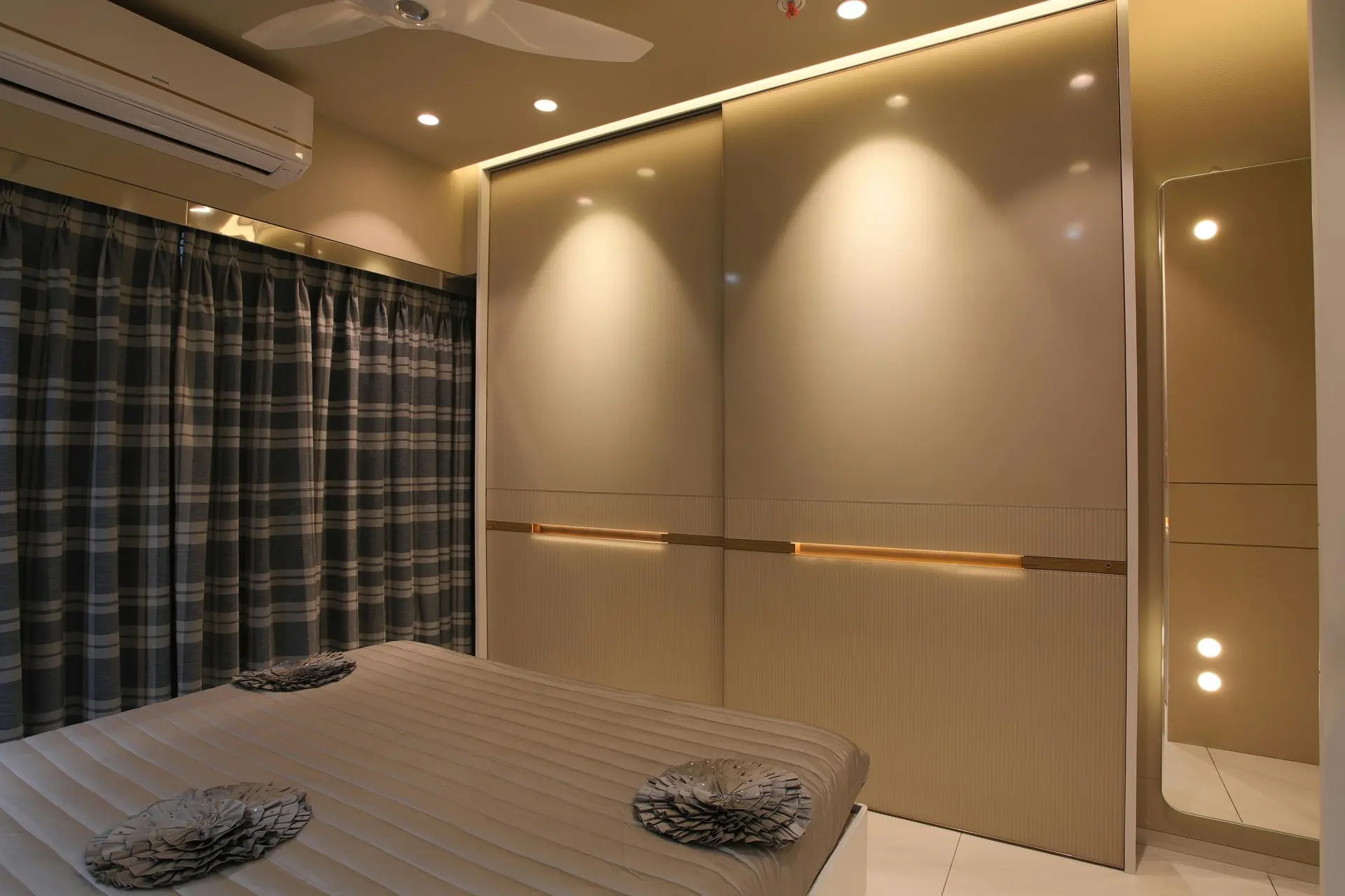Hotel wardrobe with built-in storage, hanging space, and integrated lighting