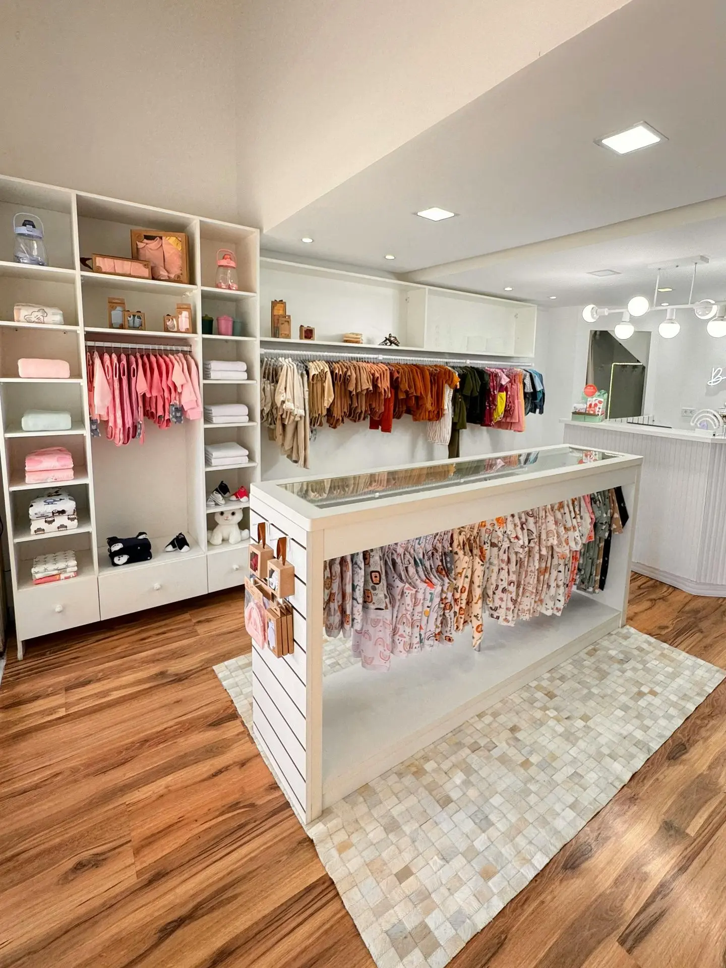 Commercial dressing room storage with open shelving and hanging rails for retail use