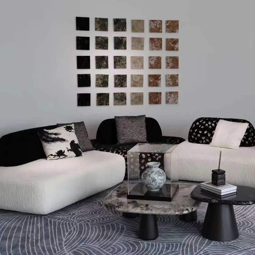 Modern loose furniture living room setup with upholstered sofa, lounge seating, and contemporary coffee tables for hospitality interiors