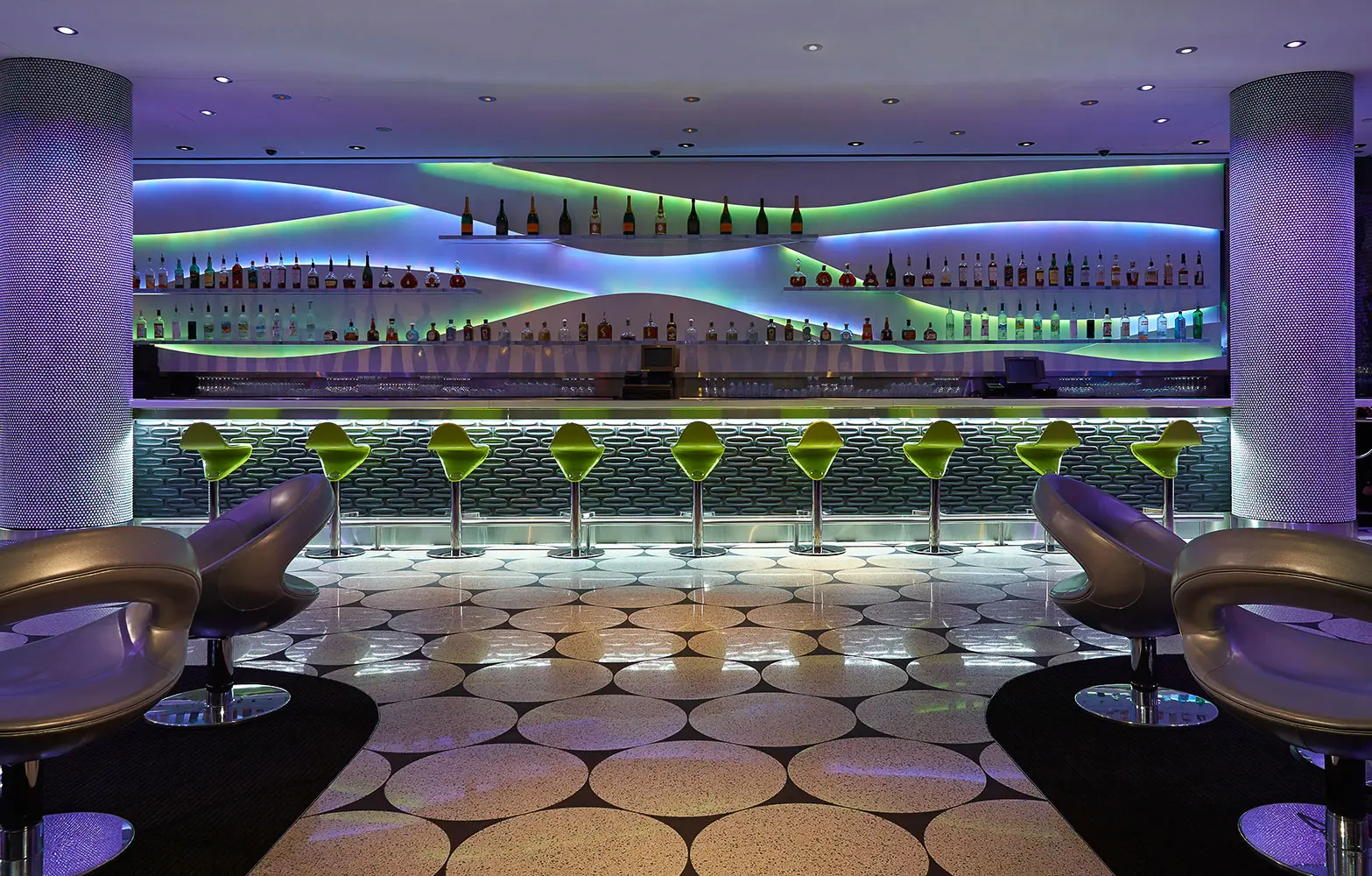 Luxury bespoke hotel bar with custom lighting and unique interior design for boutique hospitality