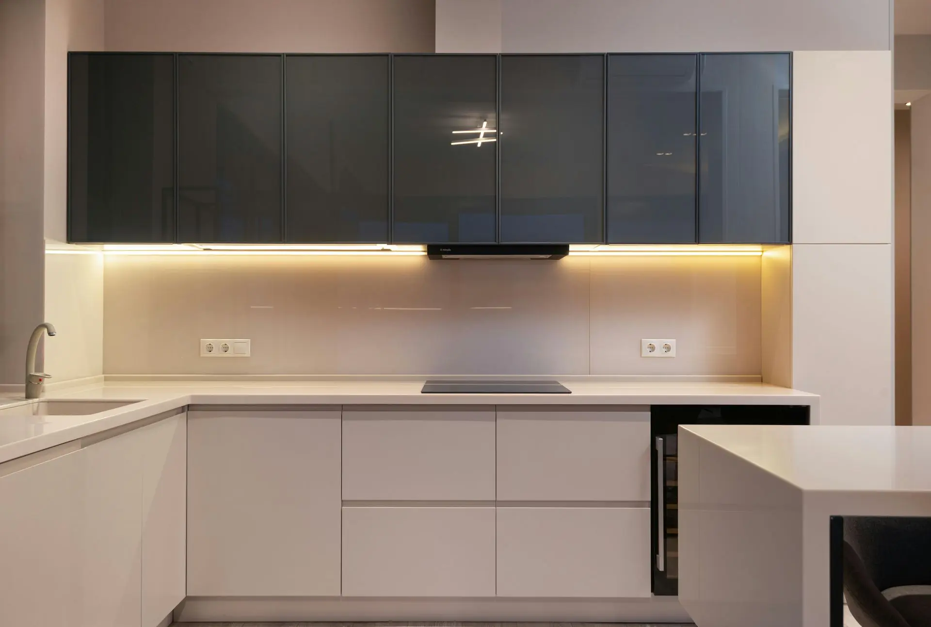Modern custom kitchen cabinetry with under-cabinet lighting and sleek finishes