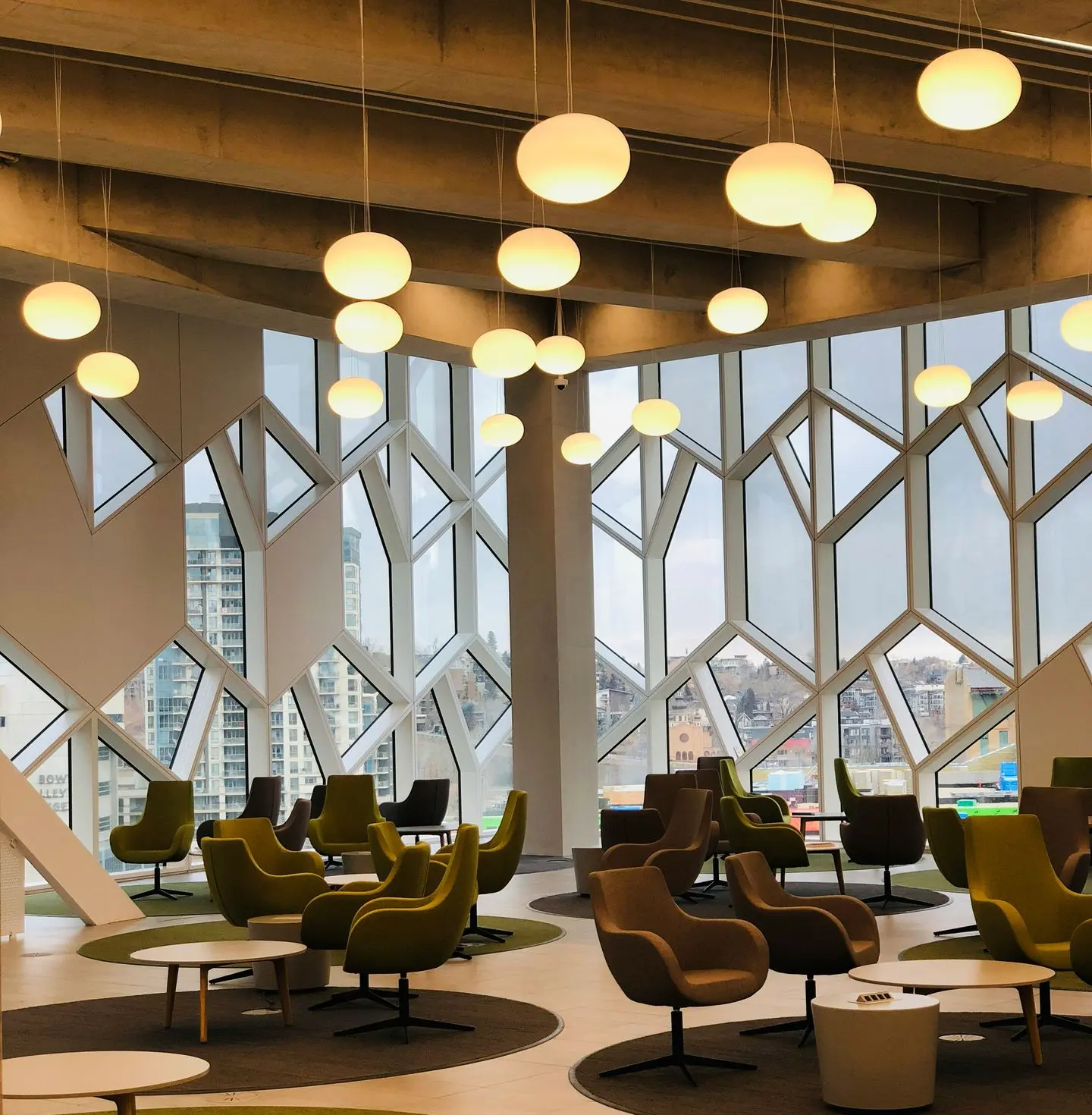 Modern hotel lounge with loose furniture seating, chairs, and tables