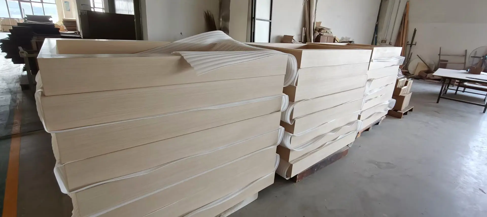 Millwork packaging and export preparation for customs compliance Wrapped wooden millwork components prepared for export and compliance requirements