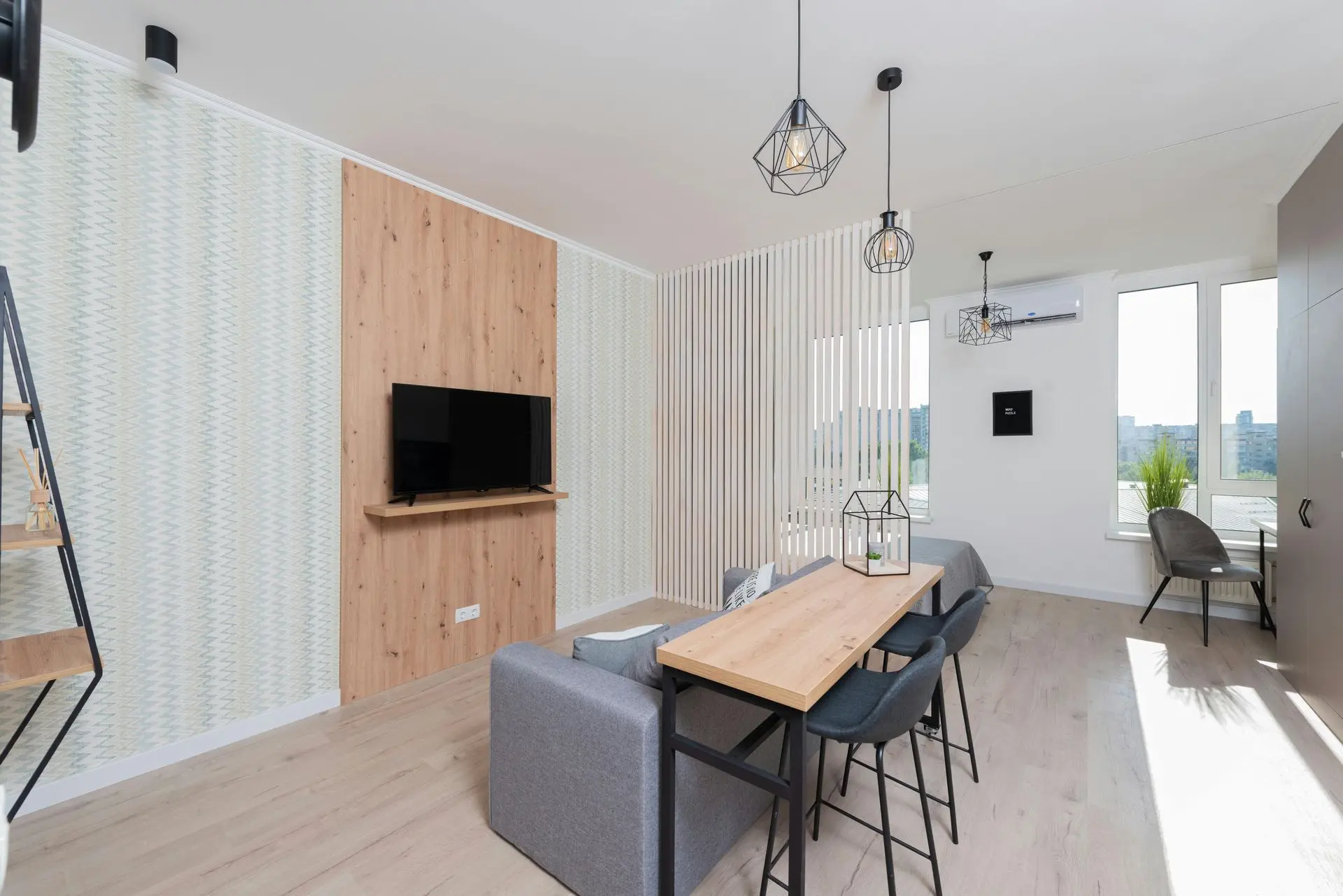 Modern apartment interior with wood panel TV feature wall, vertical slat divider, and custom architectural millwork elements