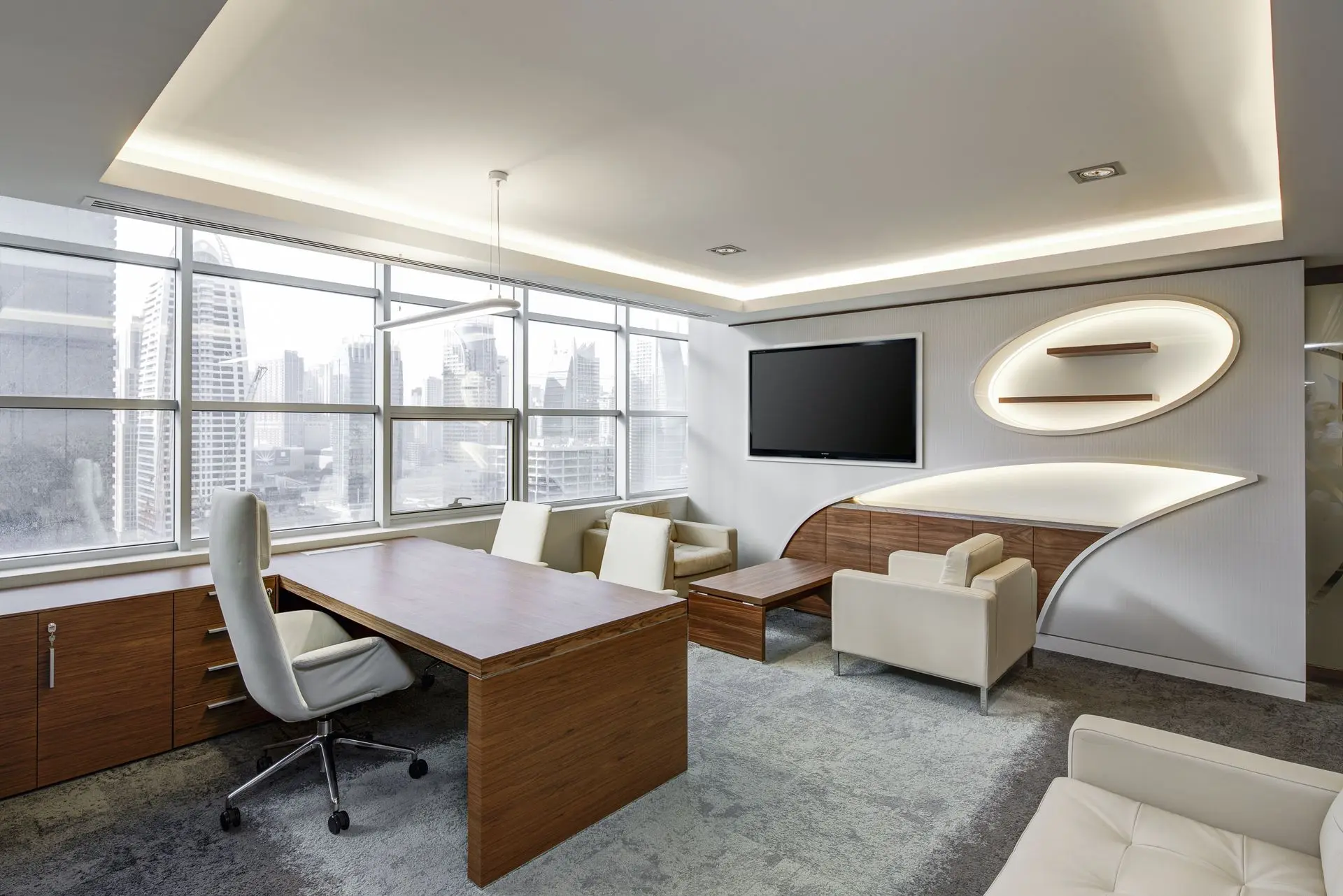 Modern executive office with built-in cabinetry, feature wall paneling, and custom architectural millwork design