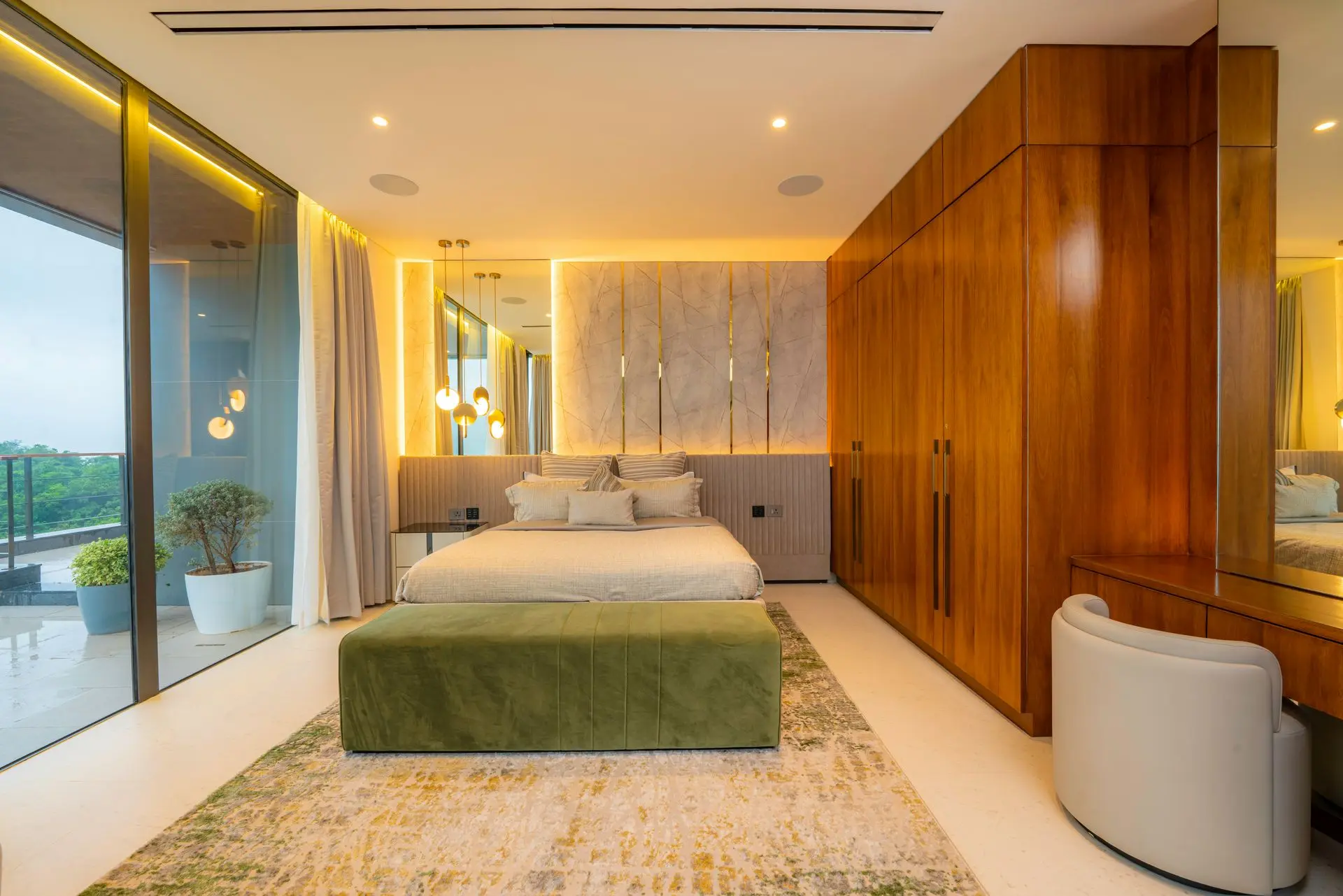 Luxury custom cabinetry in a modern bedroom featuring built-in wardrobes, natural wood finishes, and integrated lighting