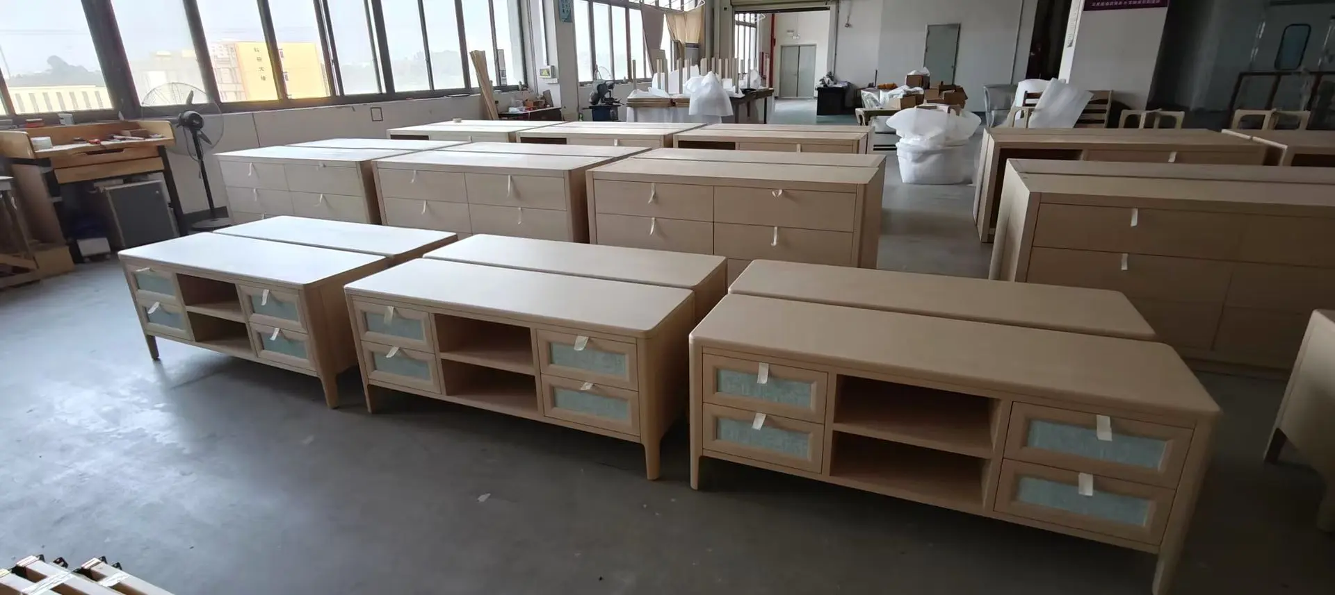 Mass production of hotel furniture in China showing identical cabinets for large hospitality projects