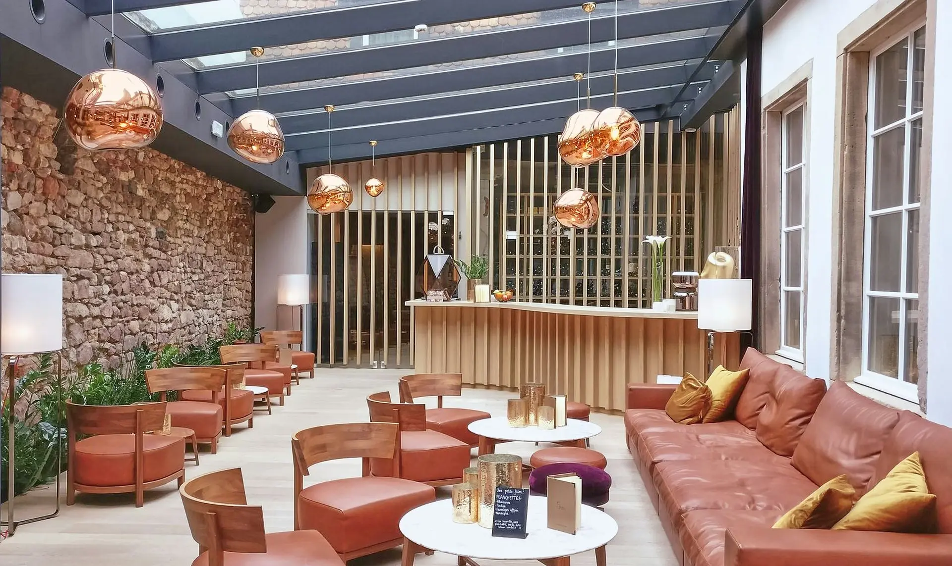 Modern contract furniture in a hotel lounge with commercial seating and leather sofas