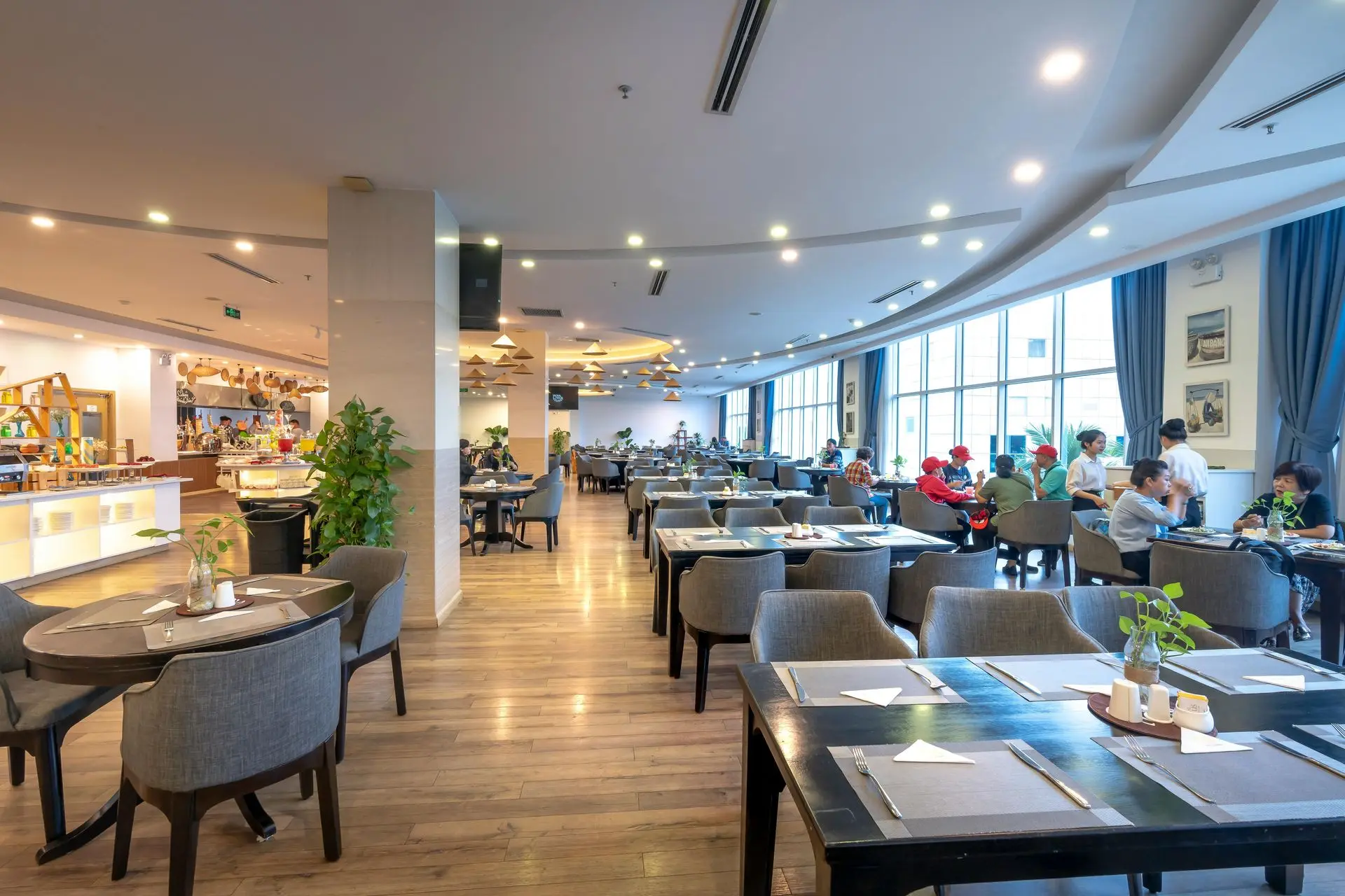 Commercial restaurant furniture with durable dining tables and chairs in busy café interior
