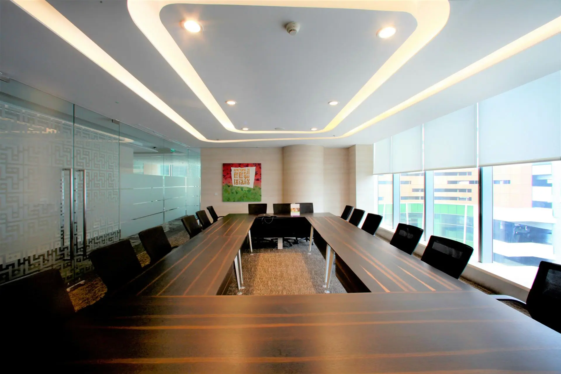 Executive Office Interior with Veneer Millwork Materials and Walnut Finish Luxury office conference table featuring veneer millwork materials with premium walnut wood finish