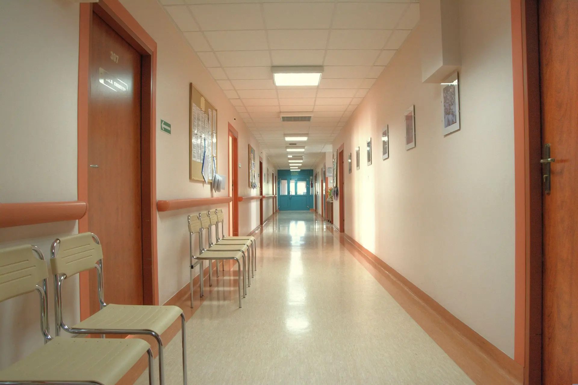 Hospital Corridor Featuring Fire-Rated Millwork and Code-Compliant Door Systems Healthcare facility corridor with fire-rated doors and commercial interior millwork