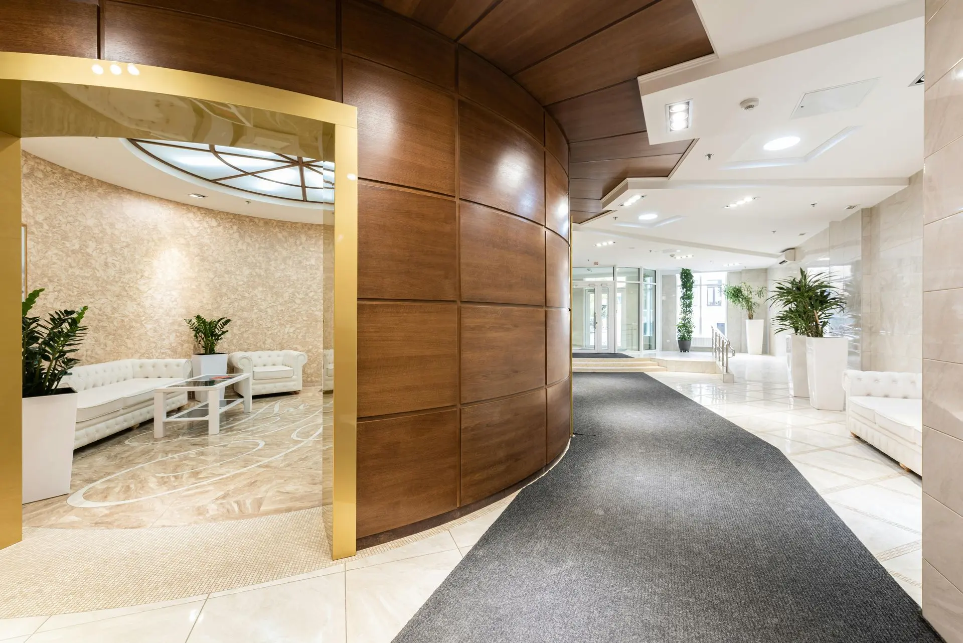 Luxury High-Rise Lobby Featuring Fire-Rated Architectural Millwork High-rise commercial lobby with fire-rated wood millwork wall panels