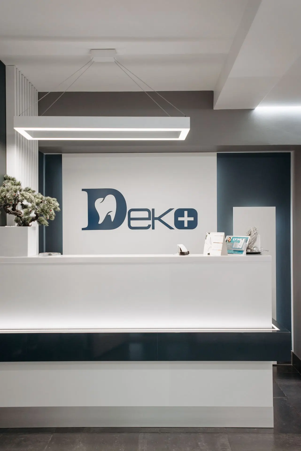 Modern Solid Surface Reception Desk with LED Lighting Modern solid surface reception desk with integrated LED lighting and custom corporate branding