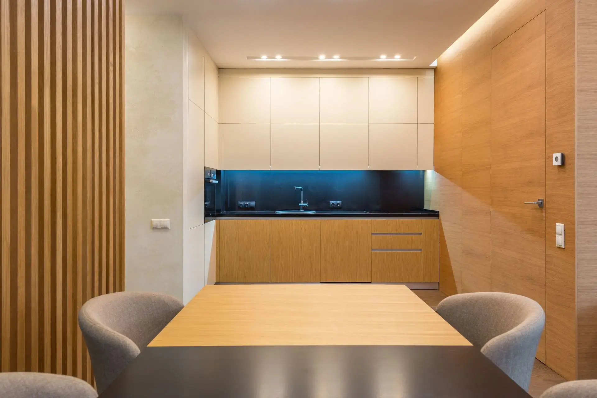 LED millwork lighting integrated into modern custom kitchen cabinetry