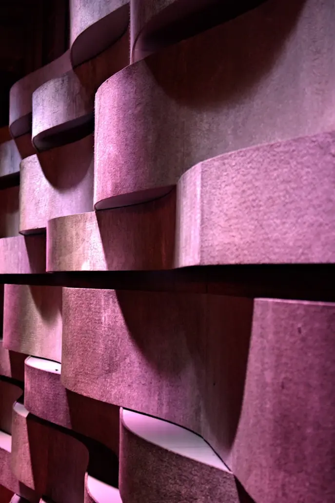 Decorative 3D acoustic wall panels with curved architectural design for modern commercial interiors.
