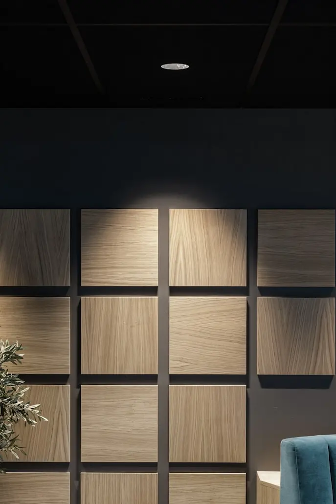 Wood veneer acoustic wall panels with different grain patterns and finishes for commercial interiors.