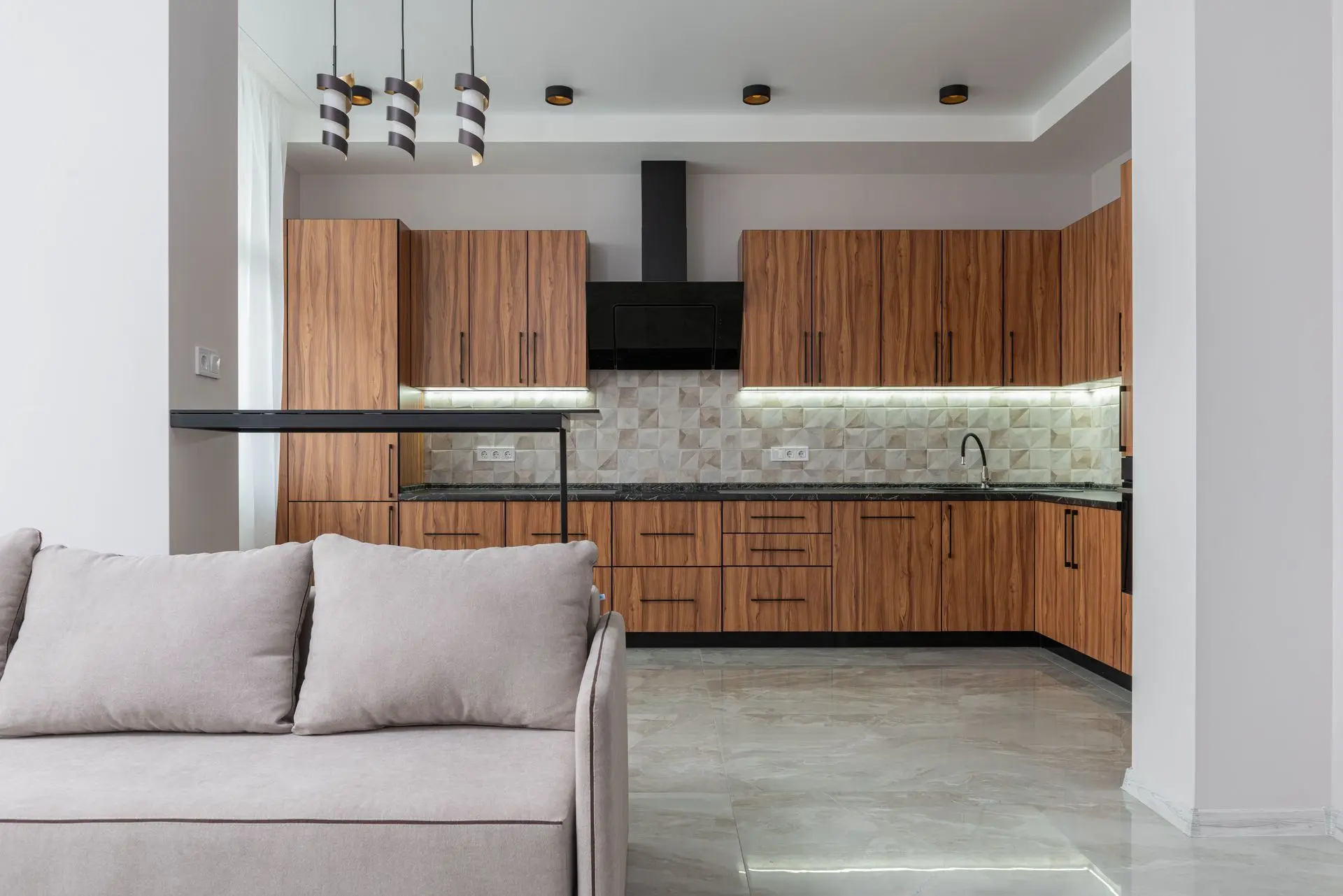 Contemporary kitchen with custom wood cabinets showcasing sustainable millwork for luxury residential projects.