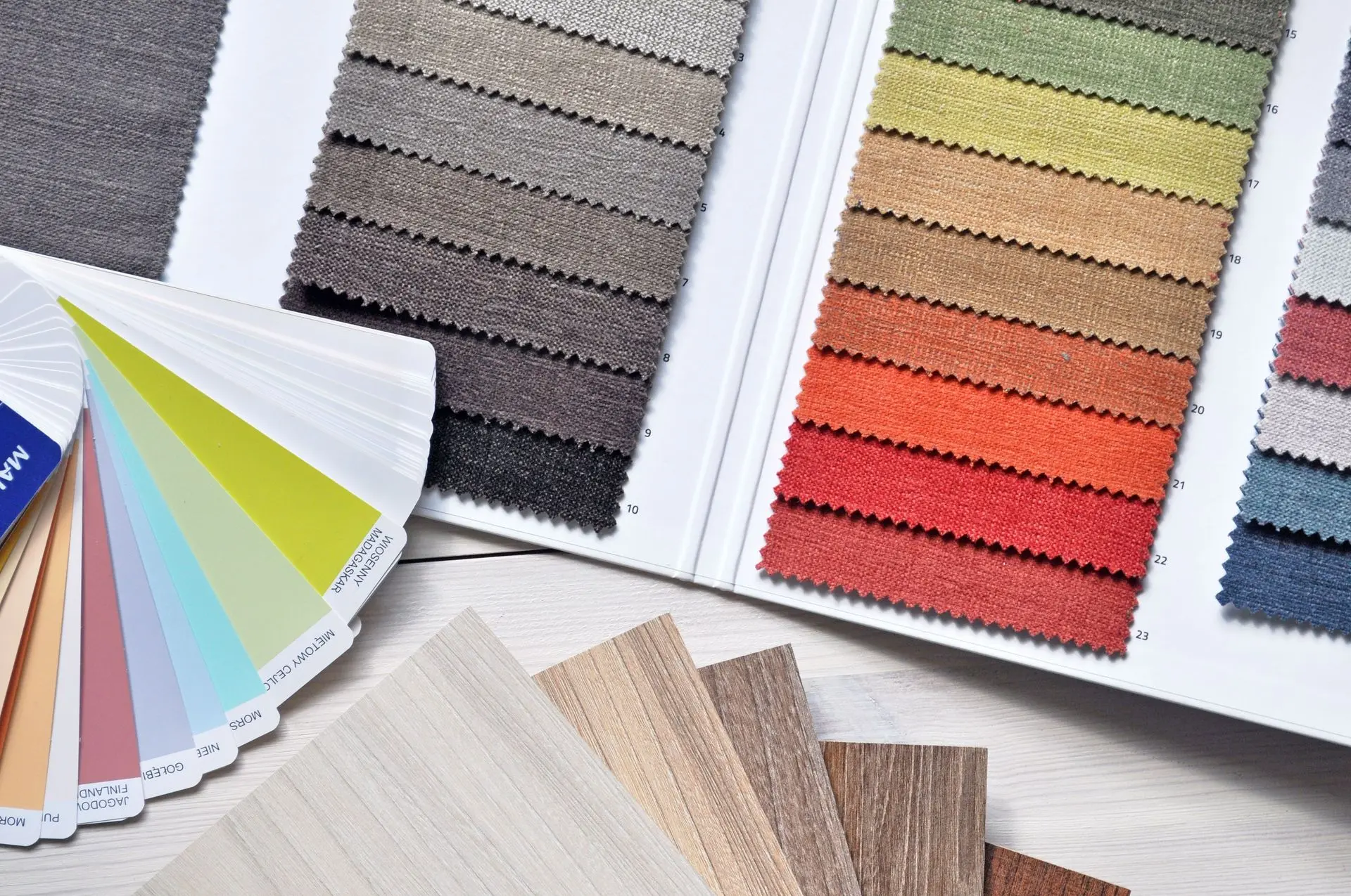 Hospitality fit out material samples with fabric, wood, and color finishes