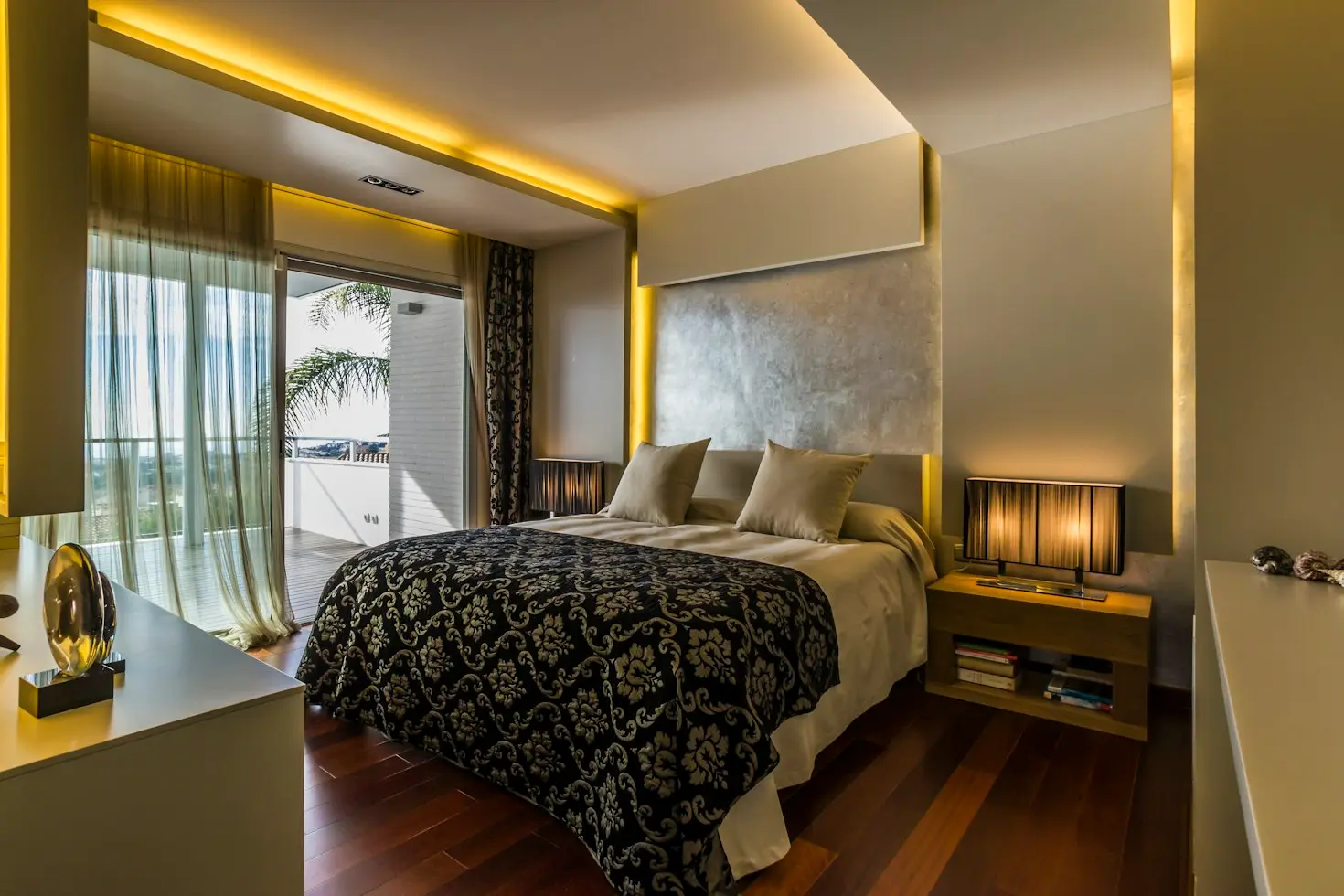 Luxury hotel guest room with custom millwork headboard and wall panels