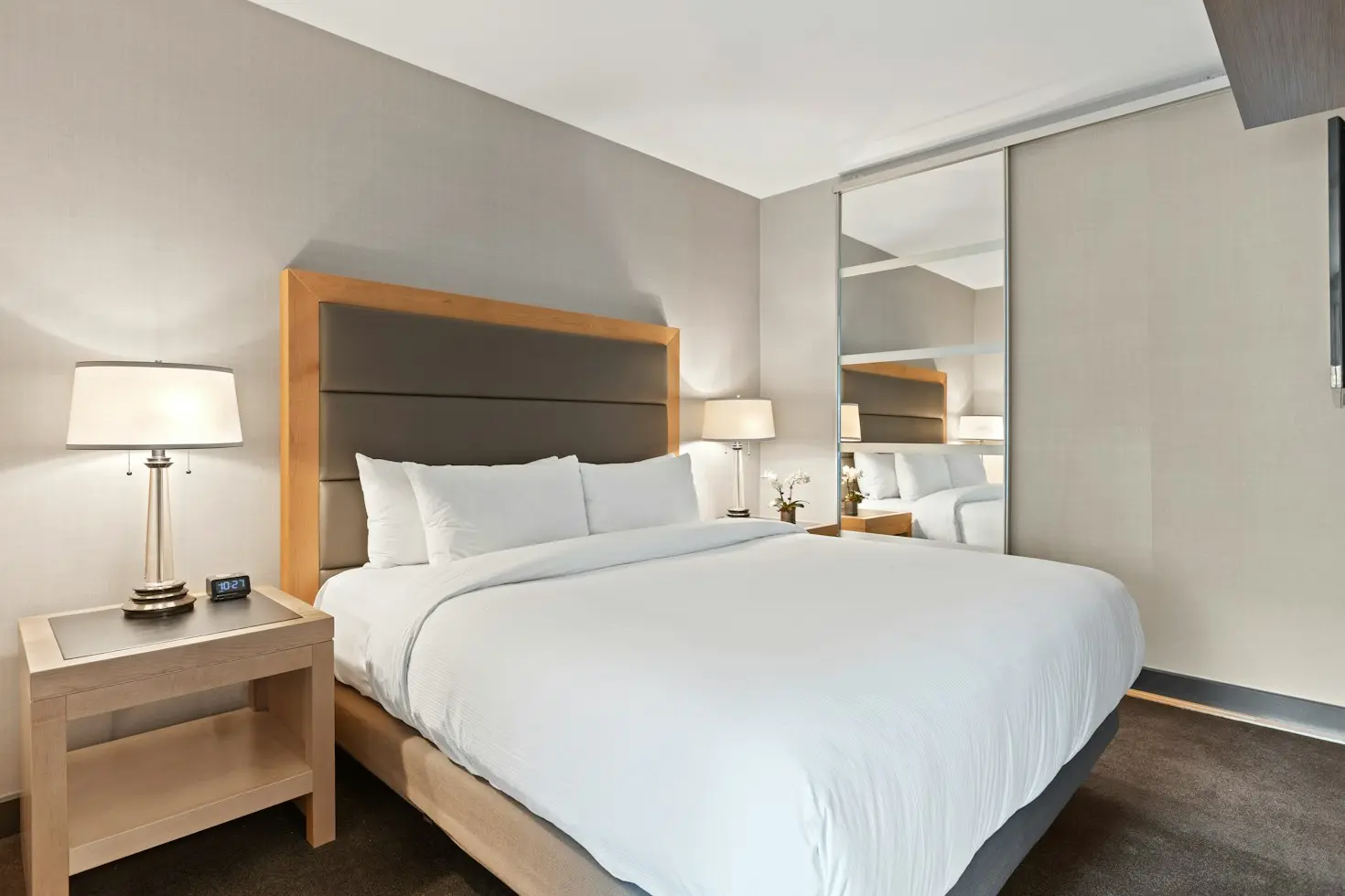 Hotel guest room with accessible floor space and built-in millwork
