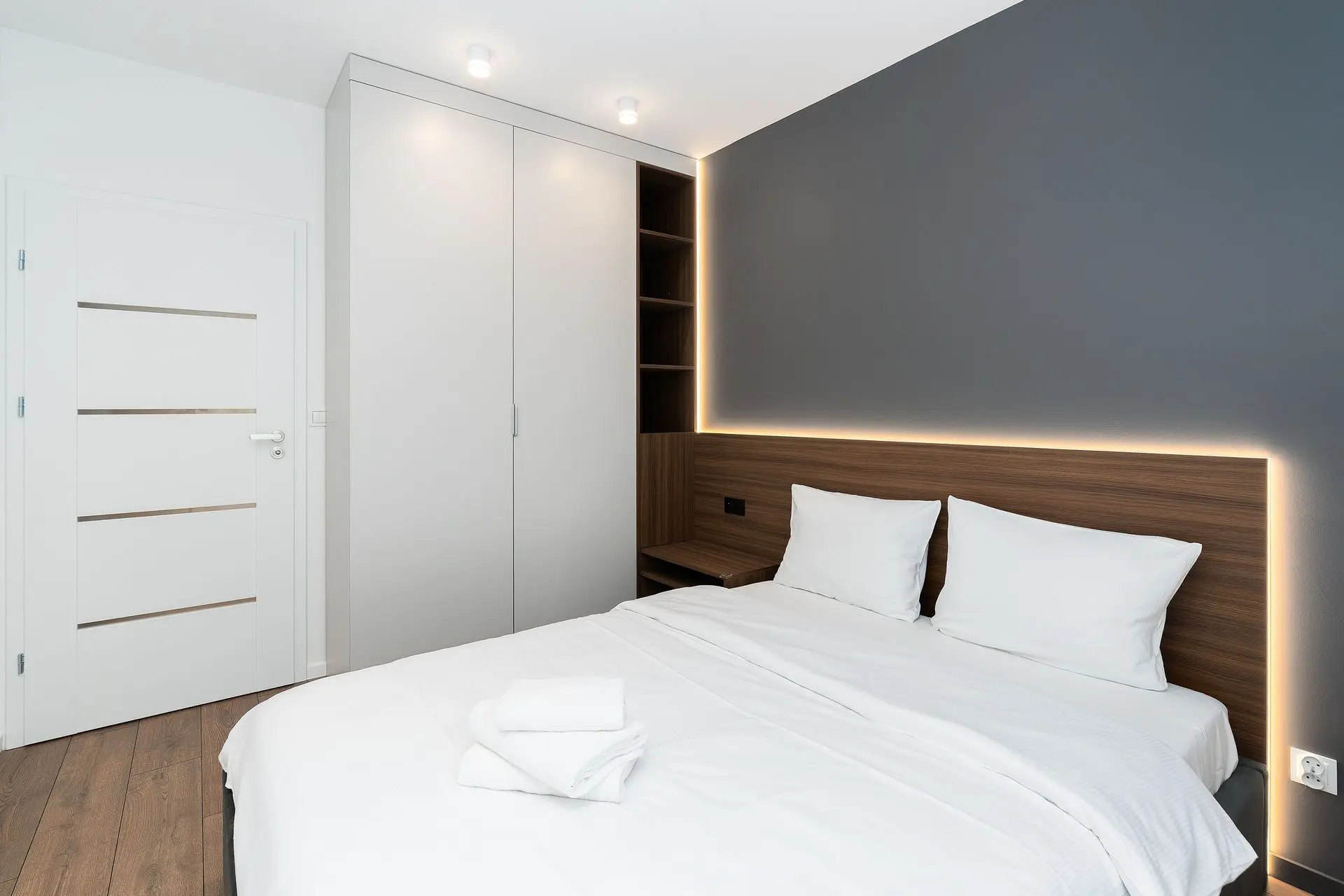 Hotel wardrobe in a modern guest room with integrated lighting
