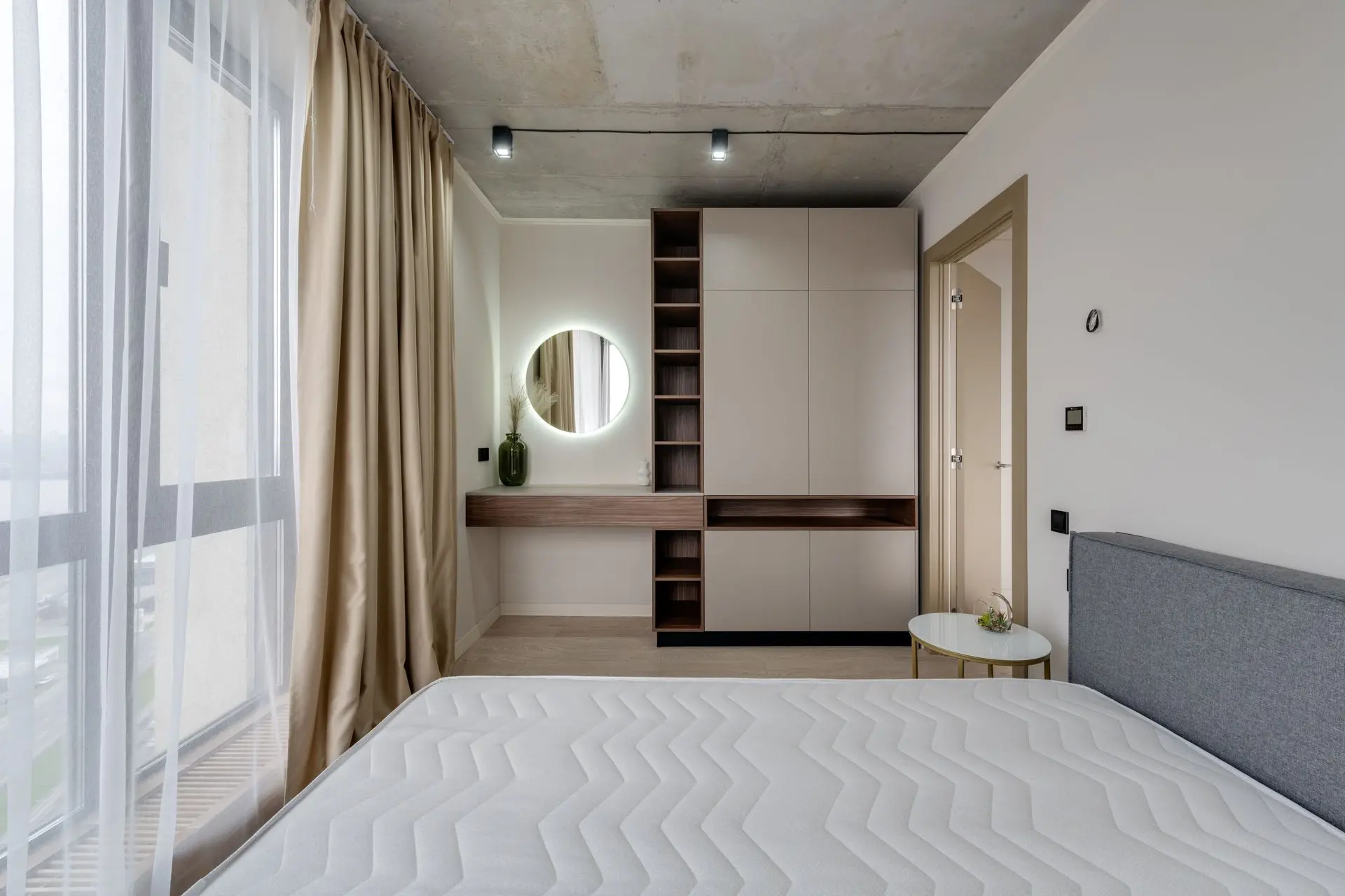 Custom hotel wardrobe with integrated storage in a modern guest room