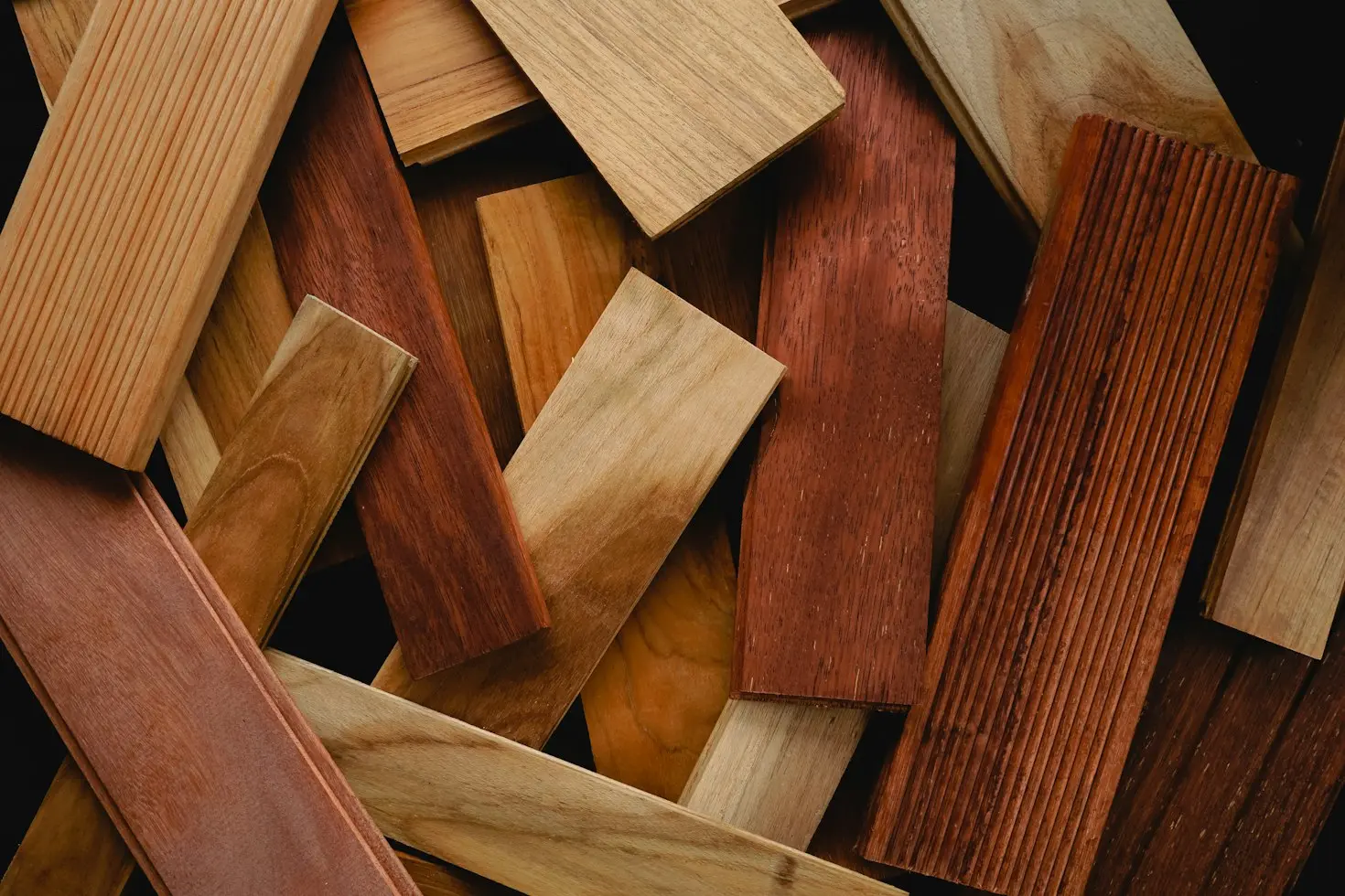 Wood samples showing different colors, grain patterns, and furniture finishes