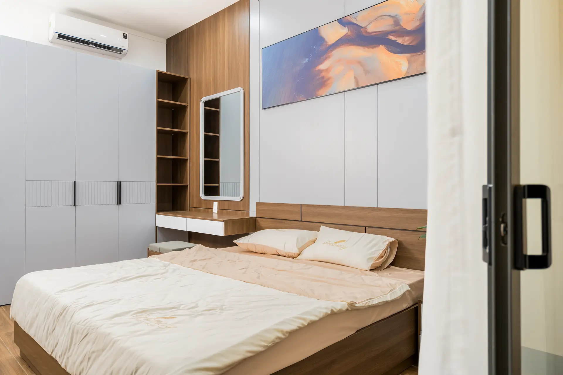 Modern bedroom with custom cabinetry and coordinated wood and white finishes